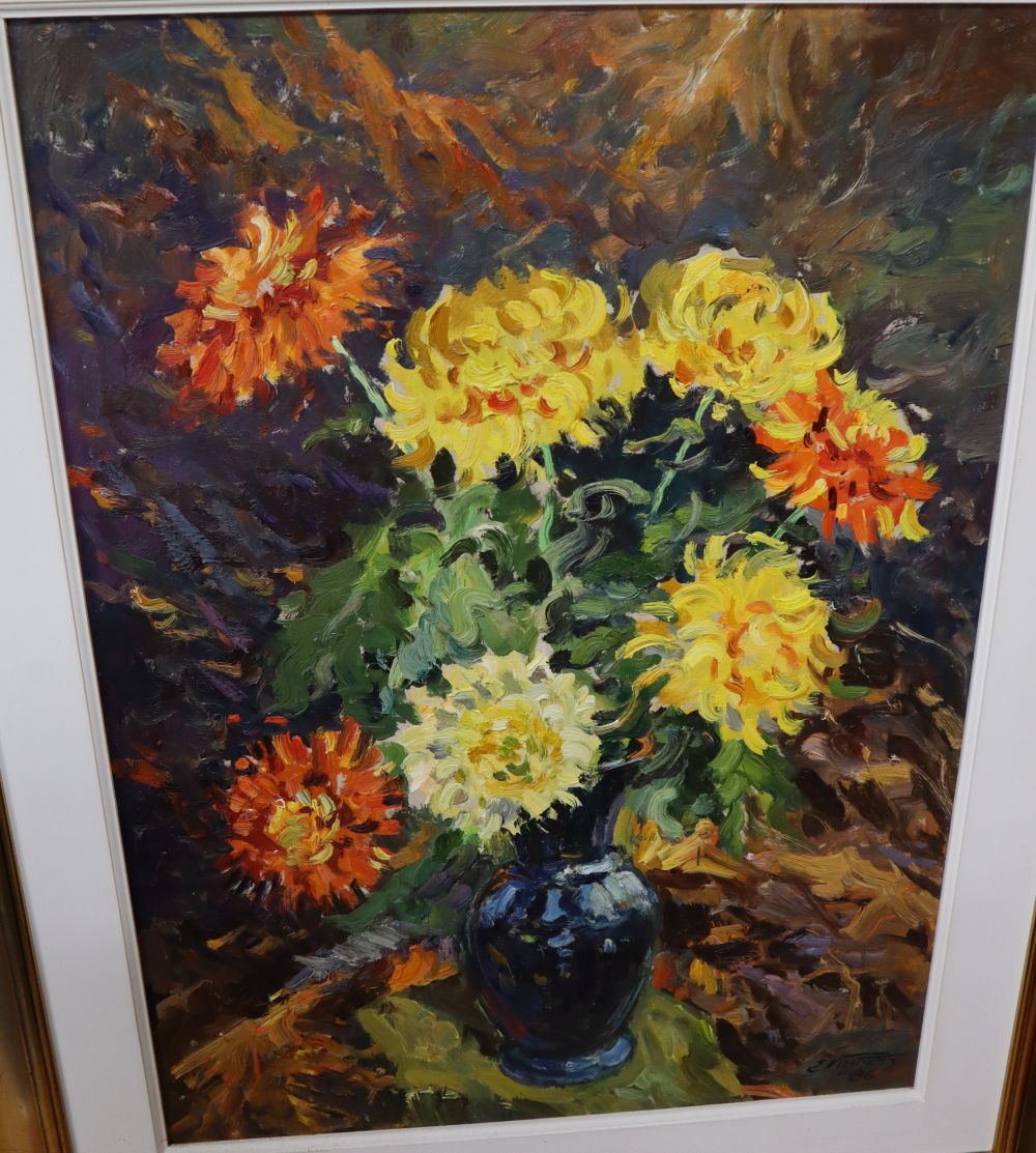 E. Vintats, oil on board, Still life of chrysanthemums in a blue vase, indistinctly signed and dated 86, 90 x 65cm